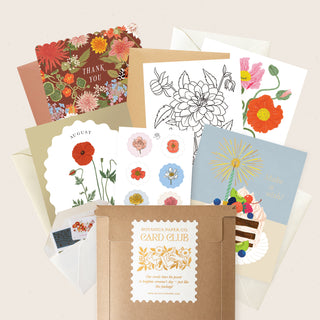 Collection of floral cards and stationery items with 'Card Club' branding.