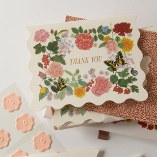 Close-up of a thank you card from the Reverie set with delicate floral artwork and gold foil details by Oana Befort.