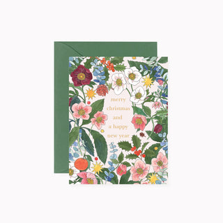 A floral greeting card with a green envelope, featuring the text 'merry christmas and a happy new year' in gold lettering over a dense illustration of winter flowers and green leaves.