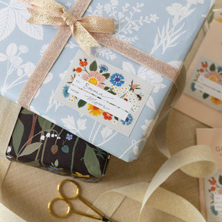 Botanist Gift Labels, Pack Of 8 illustrated by Oana Befort for Botanica Paper Co. being used for a present.