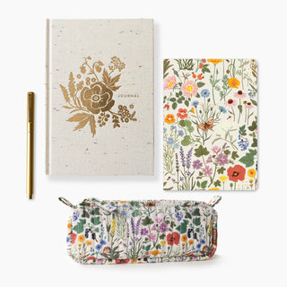 Floral notebook, pen, and pouch on a white background