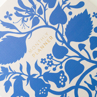 Close-up of the title of the Blue Floral Undated Monthly Planner illustrated by Oana Befort for Botanica Paper Co.
