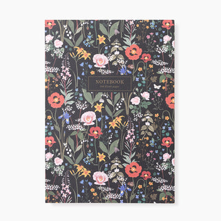 Notebook with floral design on a black background