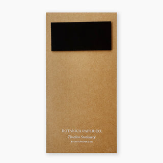 A kraft brown notepad backing with a black magnetic flap at the top and 'BOTANICA PAPER CO.' printed near the bottom, shown on a clean white background.