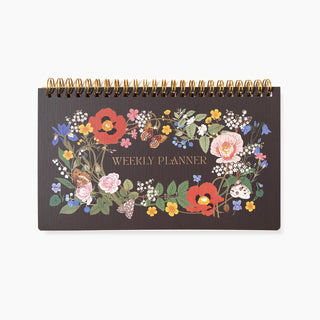 Wild Flowers Undated Weekly Planner illustrated by Oana Befort for Botanica Paper Co. featuring botanical flowers on a dark background with a gold foil title.