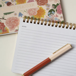 Close-up detail of an opened Reverie Undated Weekly Planner illustrated by Oana Befort for Botanica Paper Co. showing the Notes page.