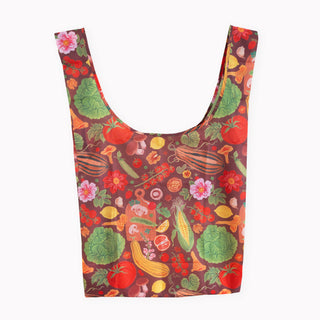 A reusable ripstop shopping bag with a colorful all-over print of vegetables and flowers on a dark red background, shown against a plain white background.