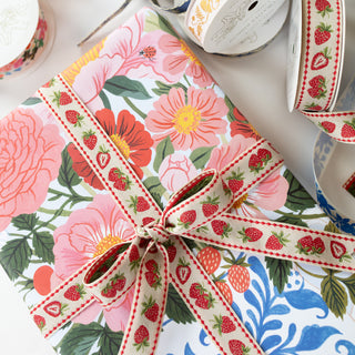 strawberry decorative ribbon in a bow on a floral gift wrap 