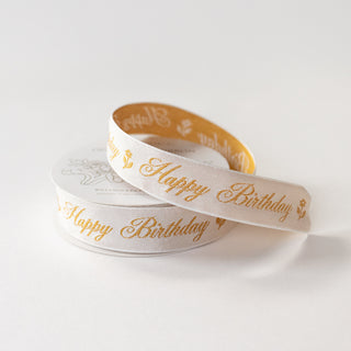 Ribbon with Happy Birthday lettering embroidered on a cream finish