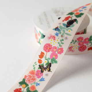 Detail of floral illustrated wide satin ribbon on a white background