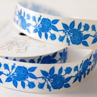 Close-up of the blue roses sarin ribbon on a spool