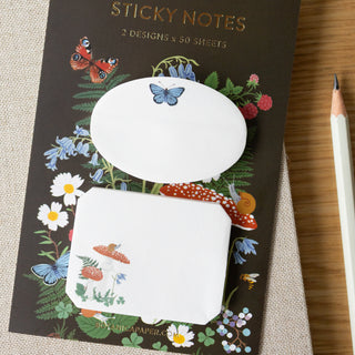 Sticky notes with nature-themed design on packaging, featuring butterflies and flowers.