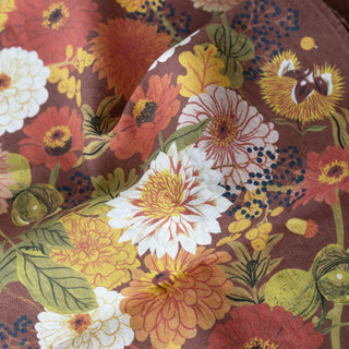 Detail of Fall tea towel by Oana Befort showing the premium European linen's natural weave with intricate autumn leaf veining and acorn cap textures rendered in rich seasonal hues of amber, burgundy, and golden brown