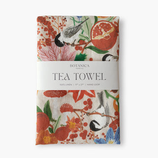 Winter 100% linen tea towel by Oana Befort featuring seasonal botanical illustrations of chickadees perched among winter branches with pomegranates and frost-kissed foliage on premium European linen, 17 x 27 inches