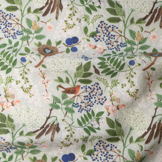 Close-up of the Flowering Trees tea towel by Oana Befort showing the fine European linen texture and detailed botanical artwork printed with non-toxic, eco-friendly inks