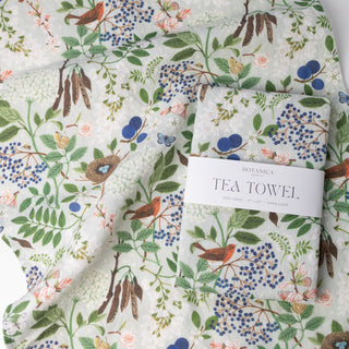 Botanica Paper Co.'s Flowering Trees linen tea towel showcasing the beautiful illustrations that add natural charm to everyday moments.