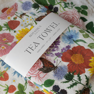100% linen SUMMER tea towel wrapped with a band — a nature-inspired gift designed by Oana Befort for Botanica Paper Co.