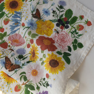 Close-up of SUMMER tea towel showing soft natural linen and vibrant summer florals hand-illustrated by Oana Befort.