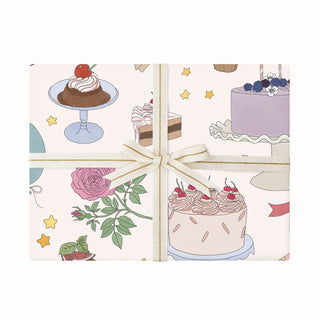 Wrapping paper with cake illustrations on a white background
