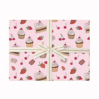 Wrapping paper with pink cake and cherry pattern on a white background