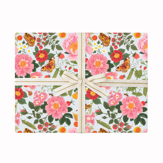 Gift wrap featuring garden florals and gold and cream ribbon