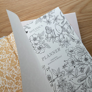Opening page of Songbirds Linen Bound Planner illustrated by Oana Befort for Botanica Paper Co.