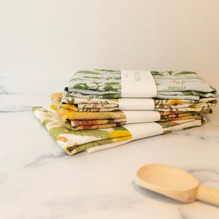Pear Orchard linen tea towel beautifully styled as a thoughtful gift, demonstrating how Botanica Paper Co.'s artfully illustrated stationery transforms functional items into celebrations of nature's abundance